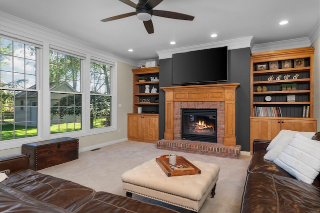 carpeted living room featuring a brick fireplace, crown molding, and baseboards