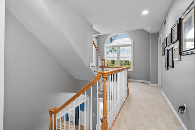 hall featuring carpet floors, recessed lighting, visible vents, baseboards, and stairs