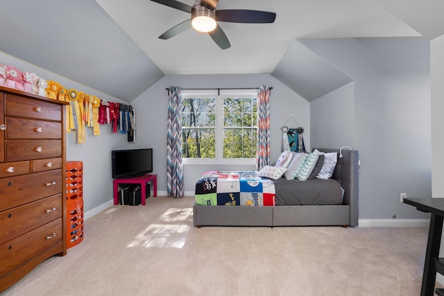 bedroom with carpet, baseboards, vaulted ceiling, and a ceiling fan