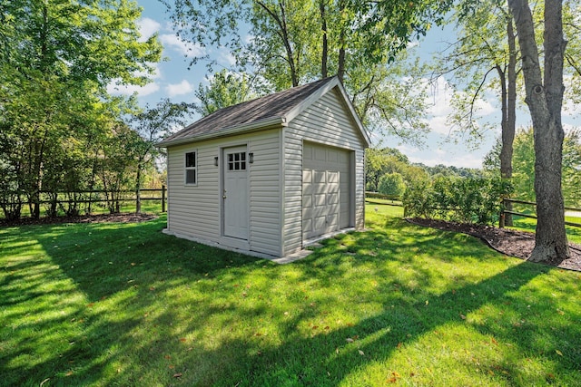 view of outbuilding with fence and an outdoor structure