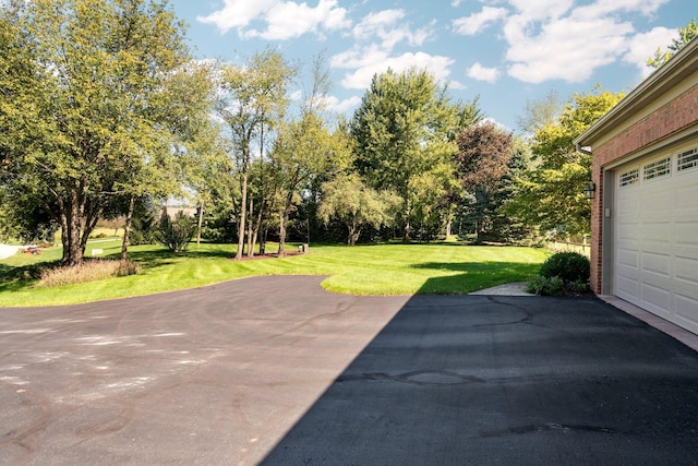 view of patio with a garage and driveway