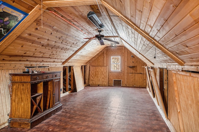 bonus room featuring vaulted ceiling, wooden ceiling, a ceiling fan, and wooden walls