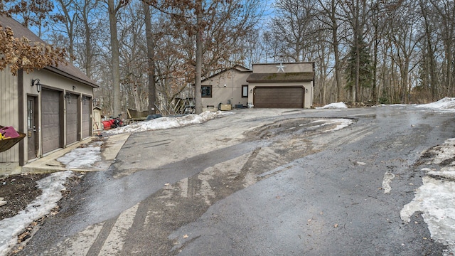 exterior space featuring a garage and stucco siding