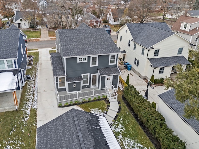 birds eye view of property with a residential view