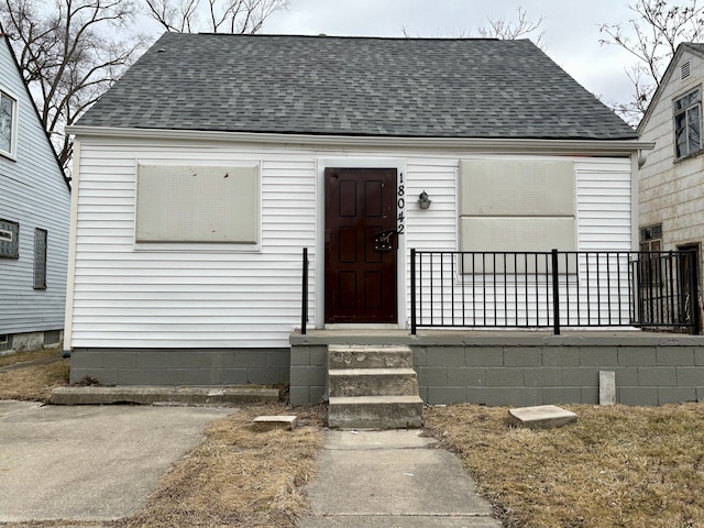 view of front of property with roof with shingles