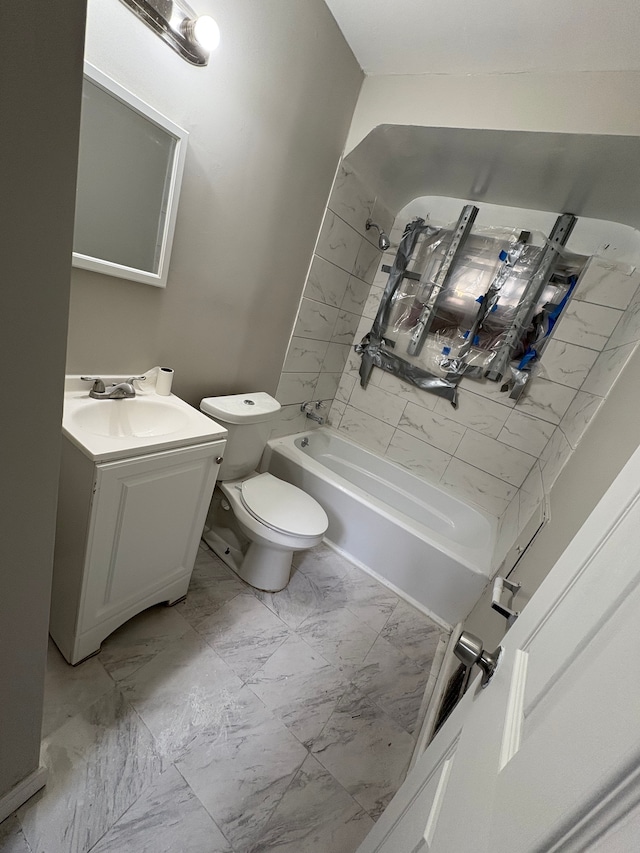 bathroom with marble finish floor, vanity, toilet, and shower / bathtub combination