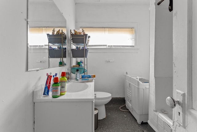 full bathroom with vanity, toilet, and a bath