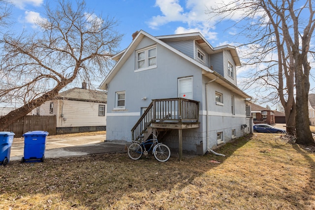 back of property with fence