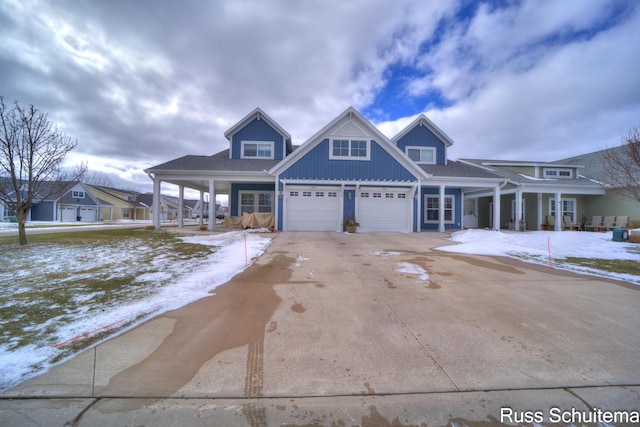 view of front of house with driveway and a porch