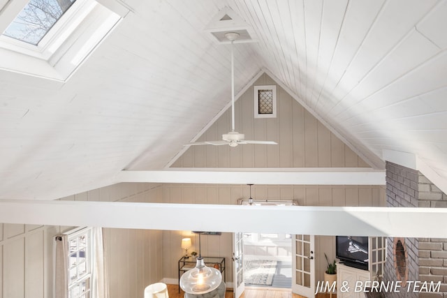 room details with wooden walls and a skylight