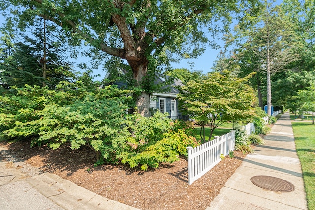 view of side of property featuring fence