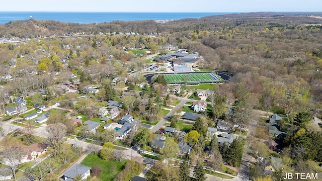 aerial view featuring a water view, a residential view, and a forest view