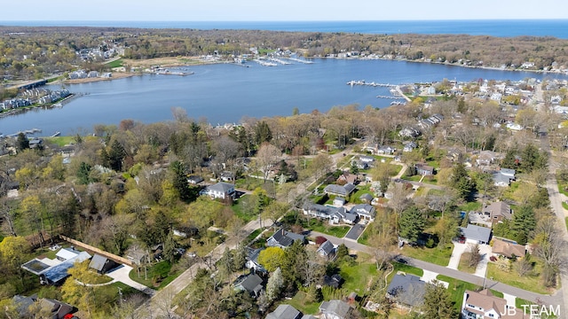 drone / aerial view with a water view and a residential view