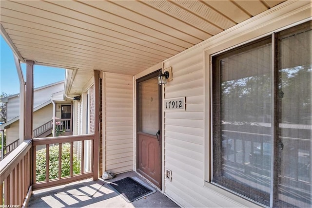 doorway to property featuring covered porch