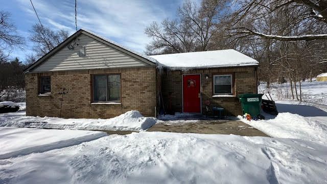 view of front of home with brick siding