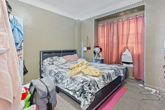 bedroom with cooling unit and carpet floors