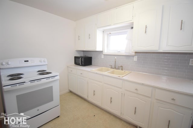 kitchen with black microwave, tasteful backsplash, white electric range, white cabinetry, and a sink