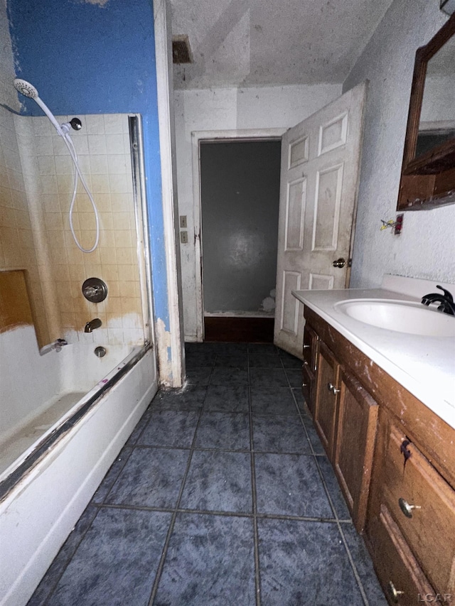 bathroom featuring tile patterned floors, bathing tub / shower combination, visible vents, and vanity