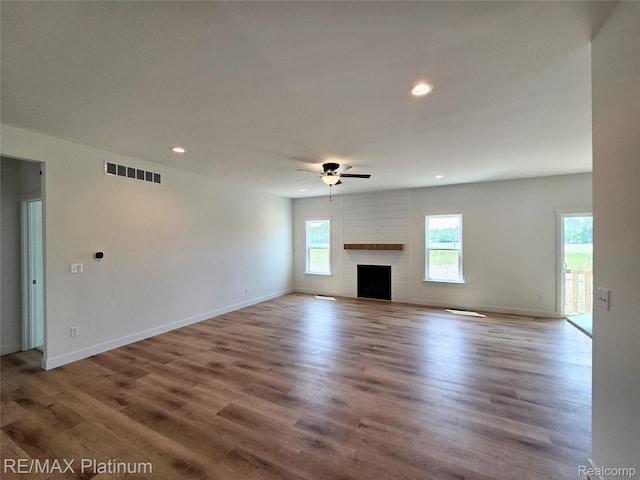 13059 River Rock Pass, Linden, MI 48451 - unfurnished living room with ceiling fan, wood finished floors, recessed lighting, and baseboards