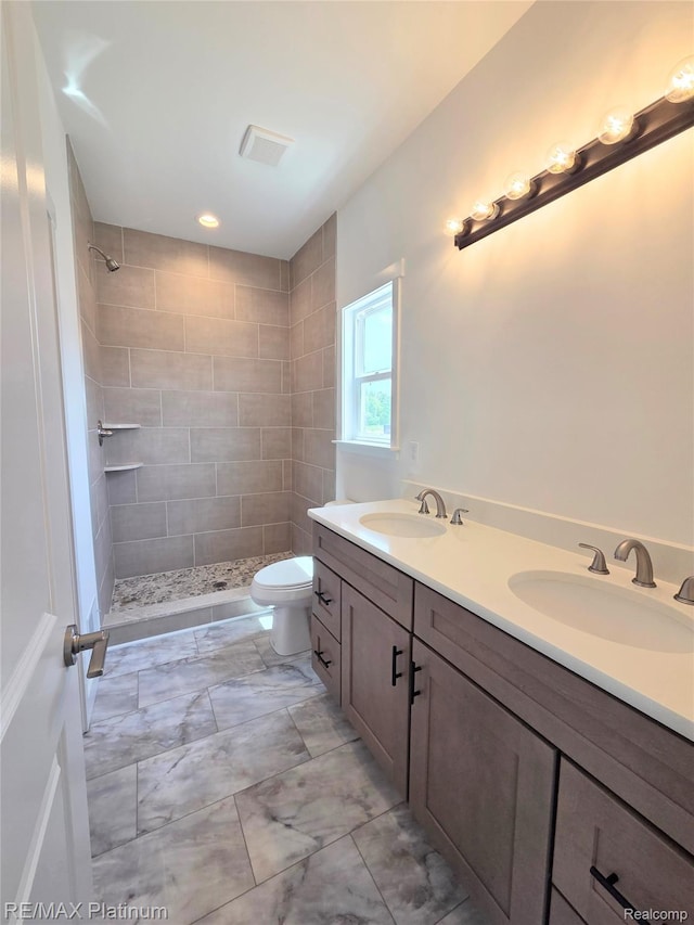 13059 River Rock Pass, Linden, MI 48451 - full bath featuring tiled shower, double vanity, and toilet