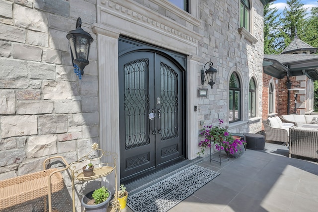 17965 Beck Rd, Northville, MI 48168 - entrance to property featuring stone siding and an outdoor hangout area