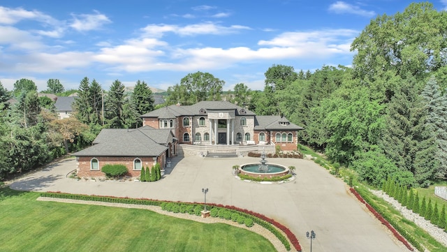 17965 Beck Rd, Northville, MI 48168 - exterior space with brick siding, curved driveway, and a yard
