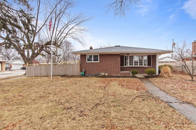 view of home's exterior with brick siding, fence, and a chimney