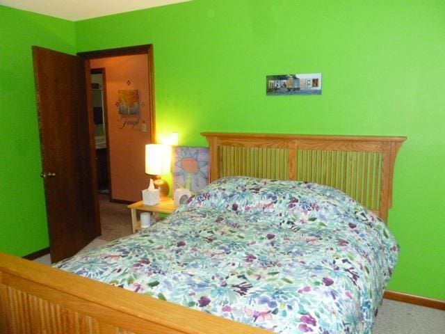 7433 E Maple Ave, Grand Blanc, MI 48439 - bedroom featuring carpet and baseboards