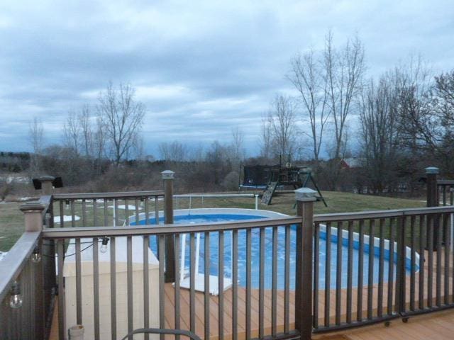 outdoor pool with a deck