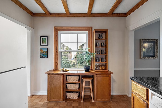 office space featuring beamed ceiling and baseboards