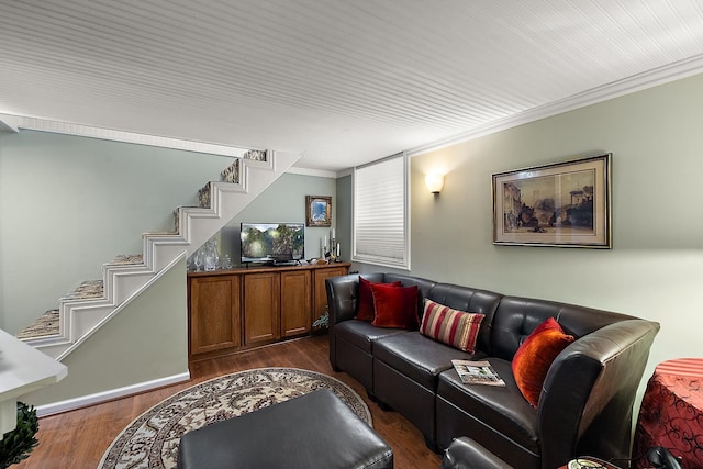 living area featuring stairs, crown molding, and wood finished floors