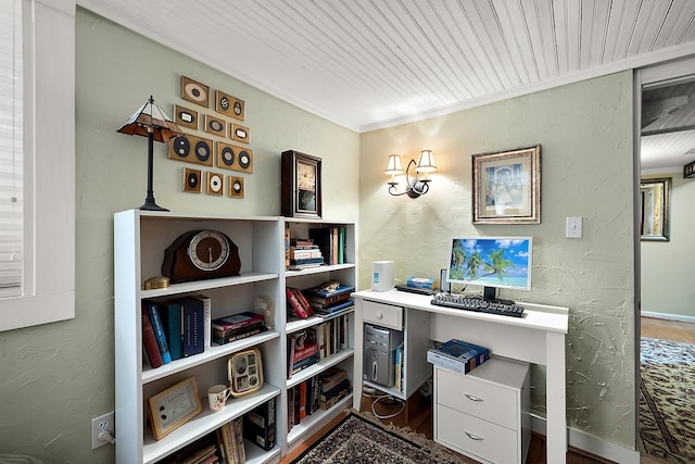 office featuring ornamental molding and a textured wall