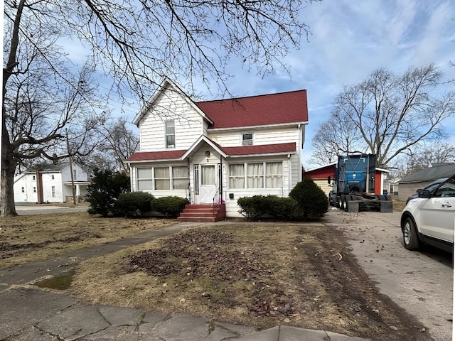 view of front of house featuring roof with shingles