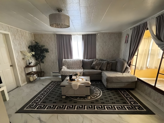 living area featuring marble finish floor, baseboard heating, and wallpapered walls