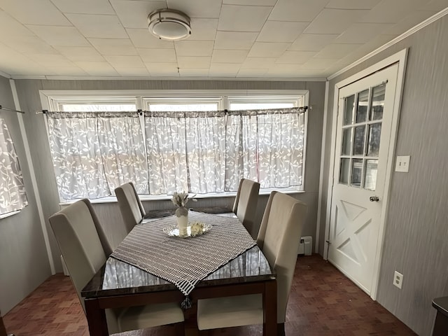 dining room featuring ornamental molding and a healthy amount of sunlight