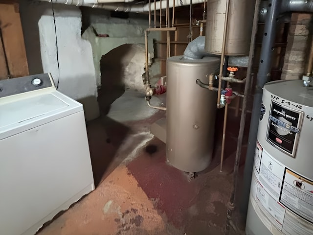 utility room with washer / dryer, gas water heater, and water heater