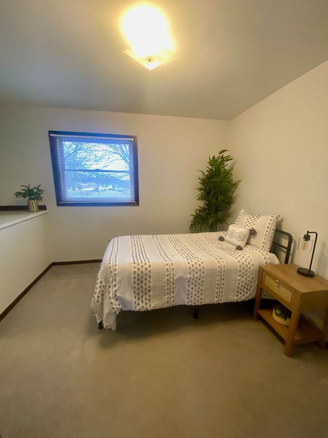 bedroom with carpet and baseboards