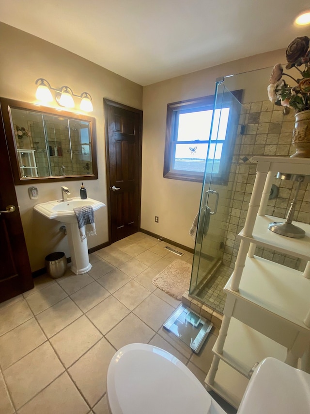 full bath featuring baseboards, a stall shower, visible vents, and tile patterned floors