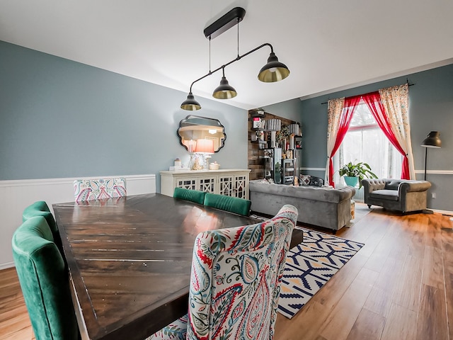 dining area with wood finished floors