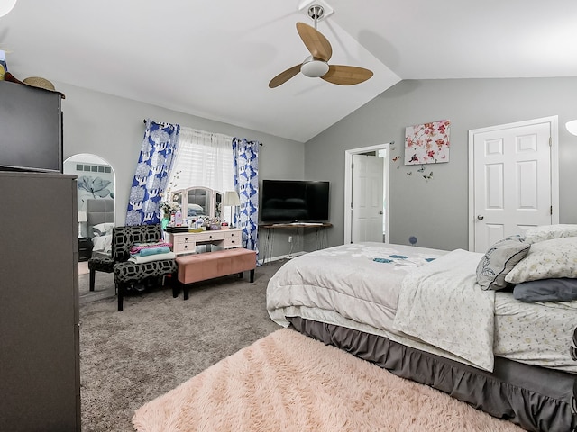 bedroom featuring carpet, ceiling fan, and vaulted ceiling