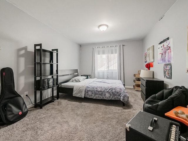 carpeted bedroom featuring baseboards