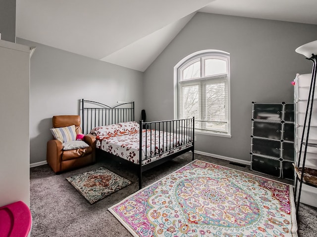 carpeted bedroom featuring baseboards and vaulted ceiling