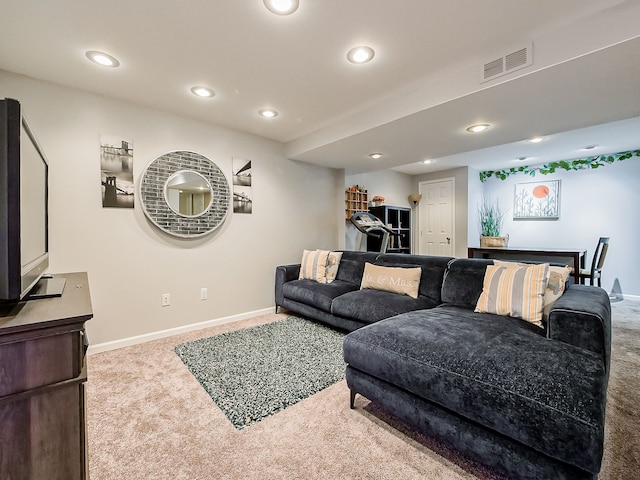 carpeted living room with visible vents, recessed lighting, and baseboards