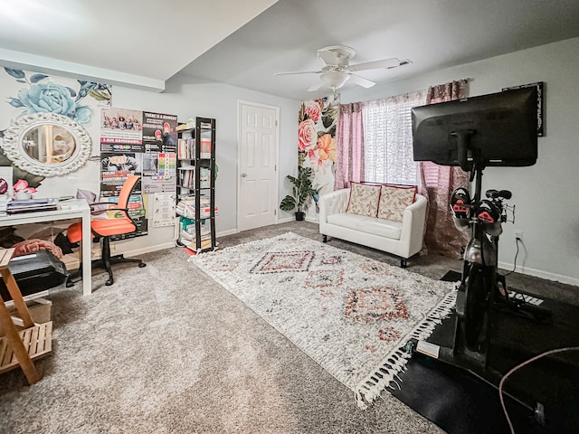 living room featuring baseboards, carpet floors, and ceiling fan