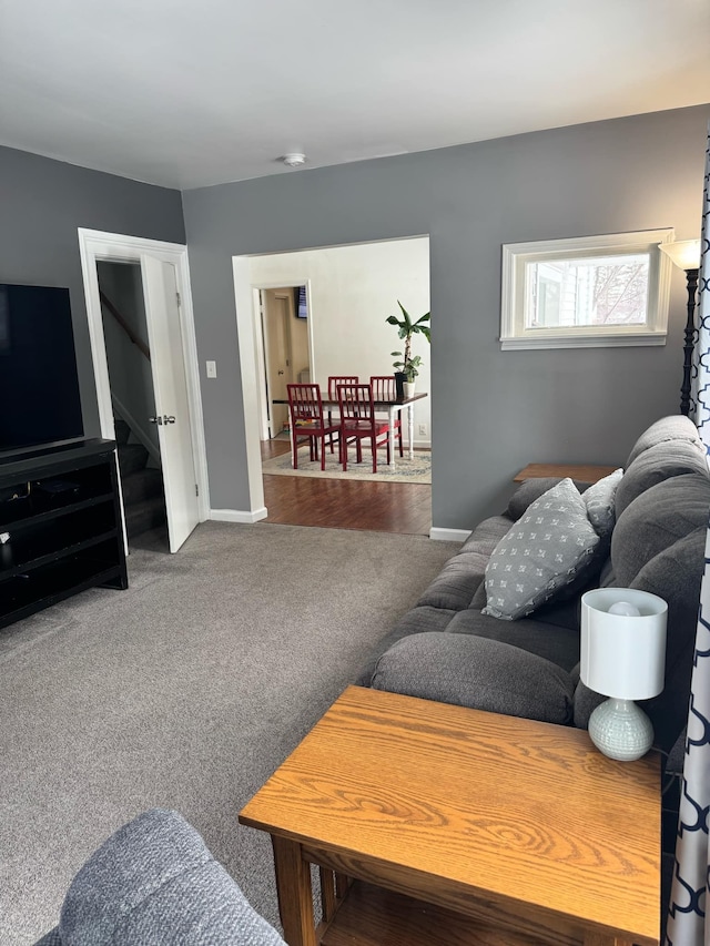 living room with carpet and baseboards