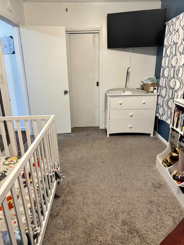 bedroom with carpet floors and a closet