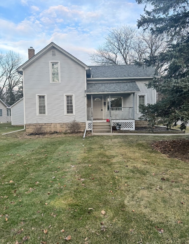 view of front of home with covered porch, roof with shingles, a front lawn, and a chimney