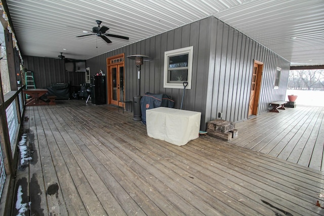 deck with ceiling fan and french doors