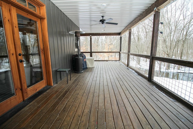 wooden deck with a ceiling fan