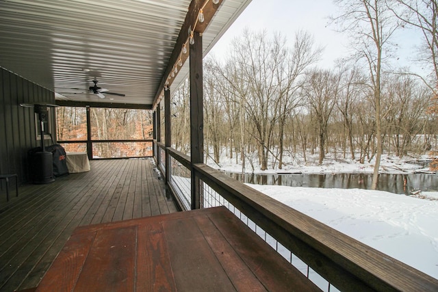 snow covered deck with a ceiling fan